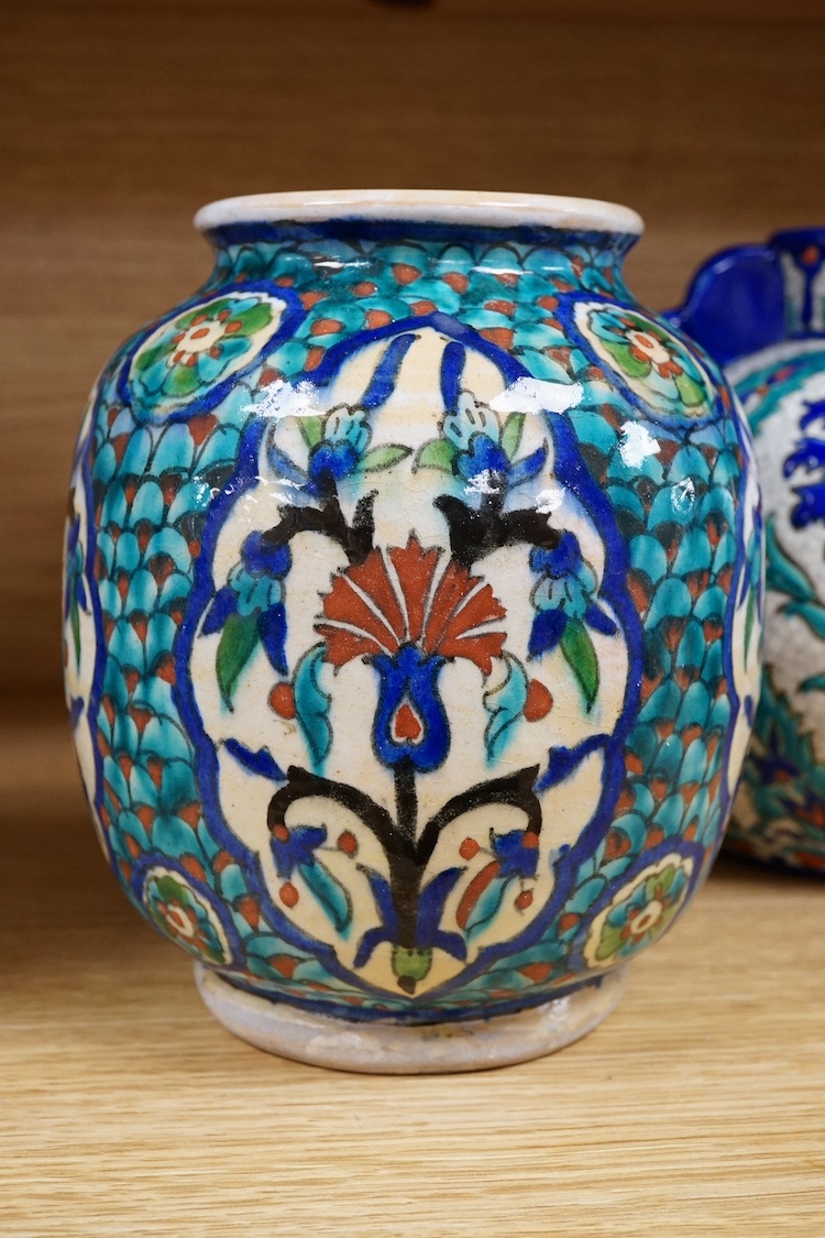 Two Persian vases and a mug, decorated with stylised flowers together with a Laroche Belgium Persian style vase, tallest 28.5cm. Condition - fair to good